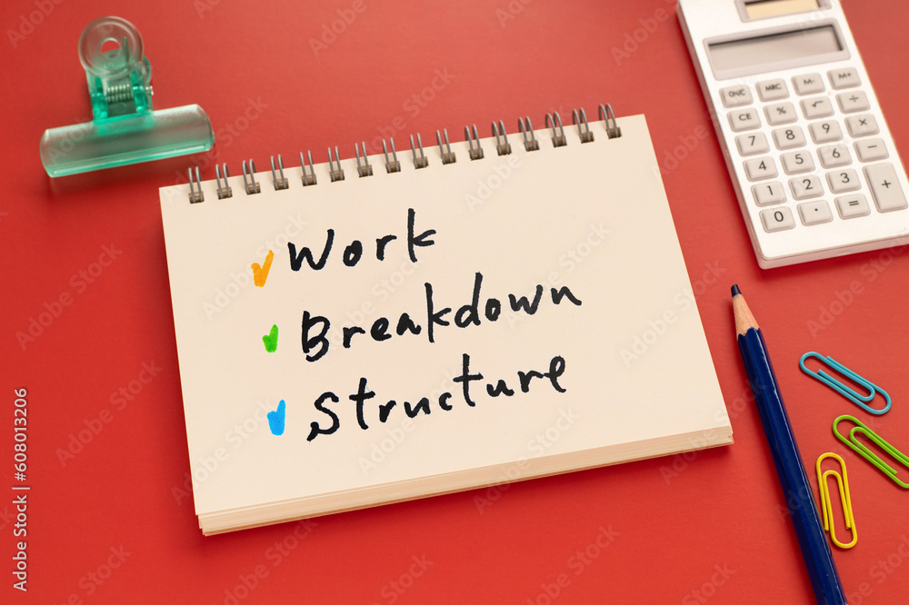 There is notebook with the word Work Breakdown Structure. It is an