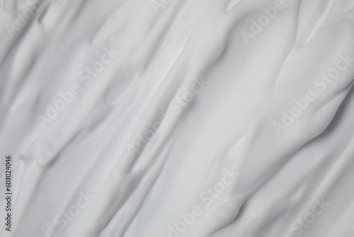 Texture of white shaving foam as background, top view