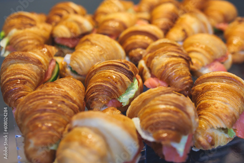 Set of coffee break in the hotel during conference meeting, with tea and coffee catering, decorated catering banquet table with variety of different pastry and bakery, with croissants and cookies