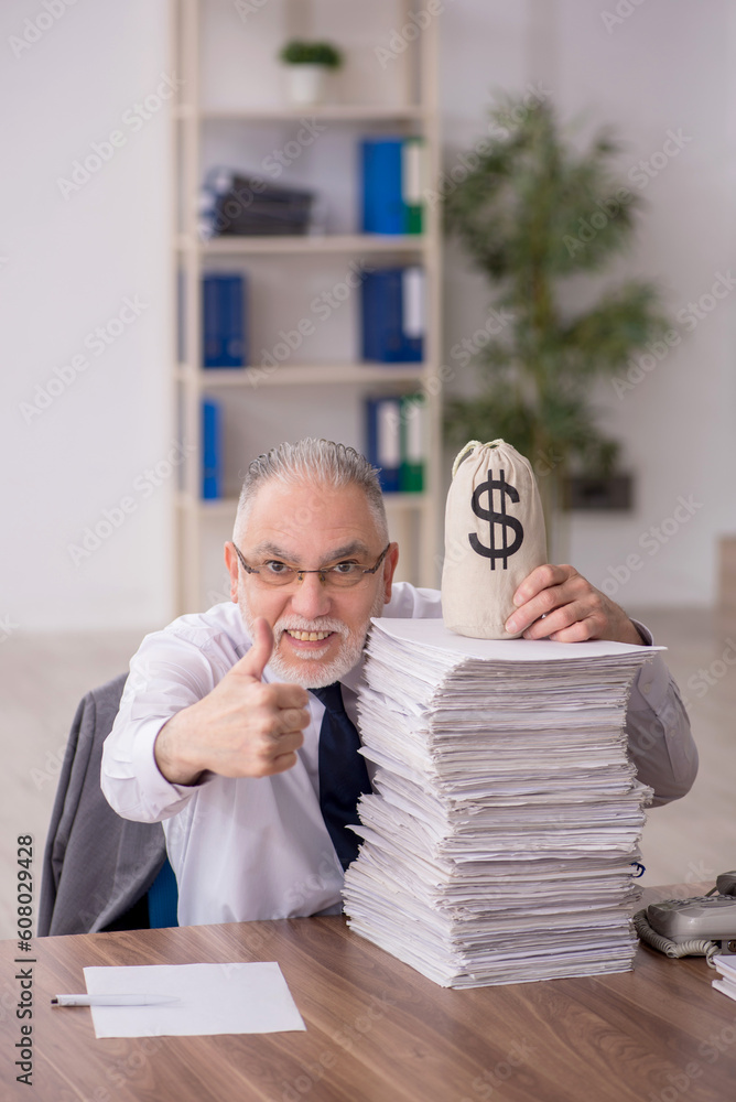 Old male employee in remuneration concept Old male employee in remuneration concept