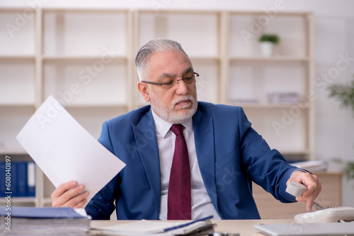 Old male employee and too much work at workplace