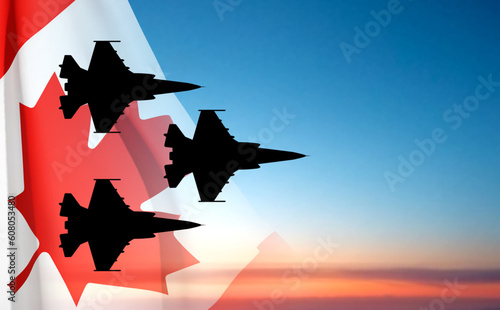 Military aircraft silhouettes with Canada flag against the sunset. EPS10 vector photo