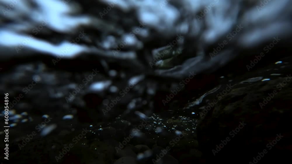 Underwater view with flowing water in a river in Mexico at a cloudy day Underwater view with flowing water in a river in Mexico at a cloudy day