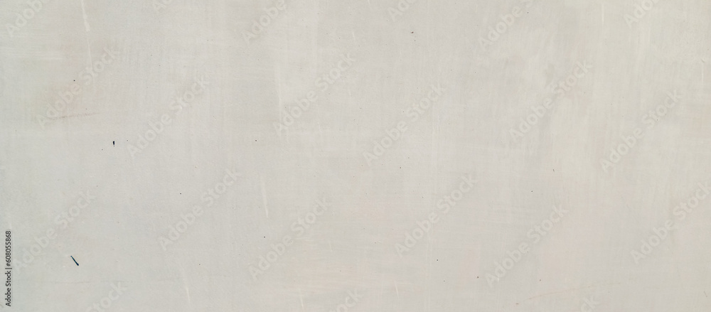 Obraz premium The texture of the gray cement wall on a gray background, taken at close range