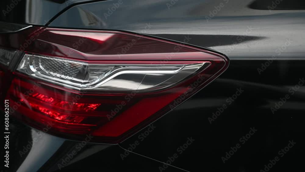 The modern Rear light or backlight body parts of the automobile car in the capital city. The modern Rear light or backlight body parts of the automobile car in the capital city.