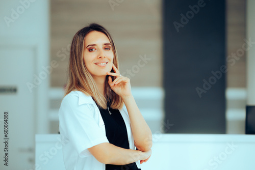 Doctor Standing in Clinic Reception Feeling Confident and Positive. General practitioner welcoming her patients in a hospital with positive attitude 