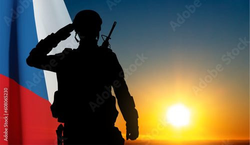 Silhouette of a sakuting soldier agianst the sunset with Czech flag. EPS10 vector