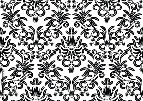 Seamless pattern from  black and white leaves can be repeated and scaled in any size 