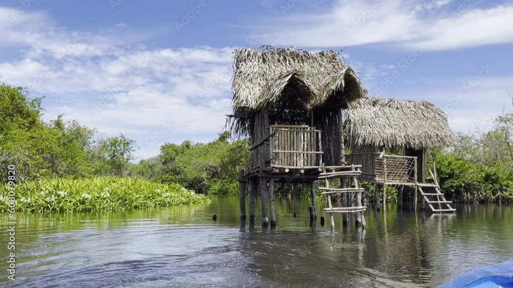 River houses while traveling aboard a boat in La Tovara Nayarit Mexico River houses while traveling aboard a boat in La Tovara Nayarit Mexico