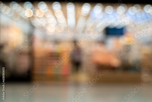 Blurred images coffee shop cafe background with bokeh and lighting bokeh of cafe restaurant background interior modern space worker lifestyle