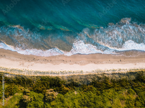 Aerial view of calm beach located at Fisherman's beach, Port Kembla, NSW, Australia