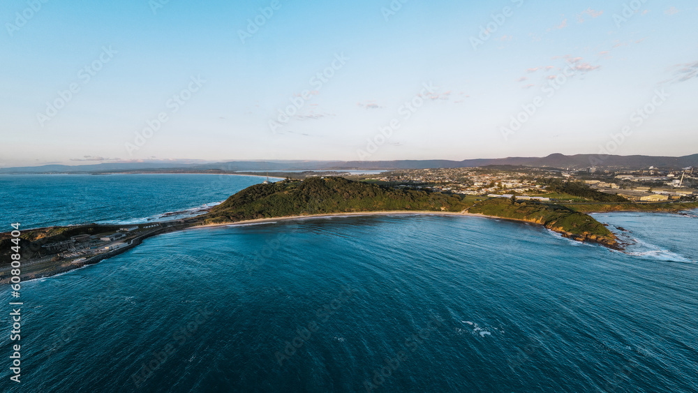 Naklejka premium Aerial view of calm beach located at Fisherman's beach, Port Kembla, NSW, Australia