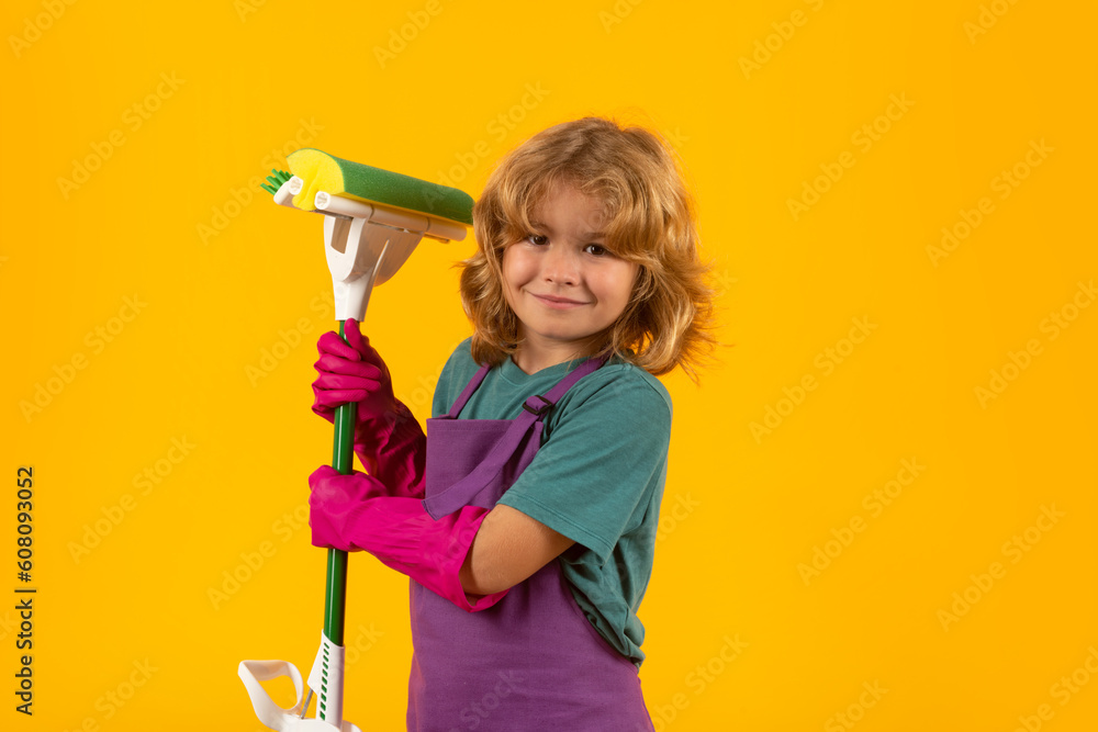 Portrait of child cleaning, concept growth, development, family relationships. Housekeeping and home cleaning concept. Child use duster and gloves for cleaning. Studio isolated background. Portrait of child cleaning, concept growth, development, family relationships. Housekeeping and home cleaning concept. Child use duster and gloves for cleaning. Studio isolated background.