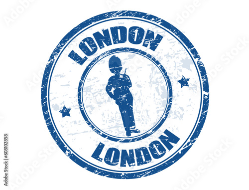 Blue grunge rubber stamp with a guard shape and the word London written inside
