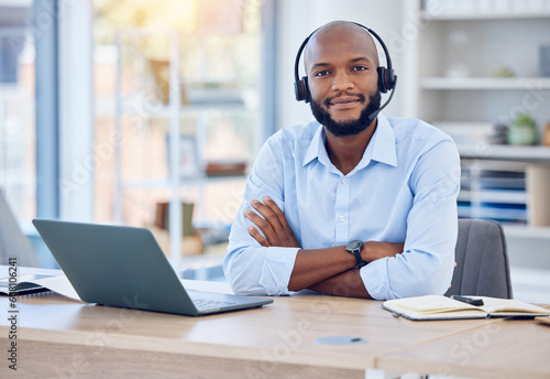 Black man, portrait and callcenter with arms crossed and contact us, communication with headset and CRM. Male consultant with smile, customer service or telemarketing with confidence and help desk