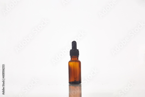 Serum dropper bottle on white background