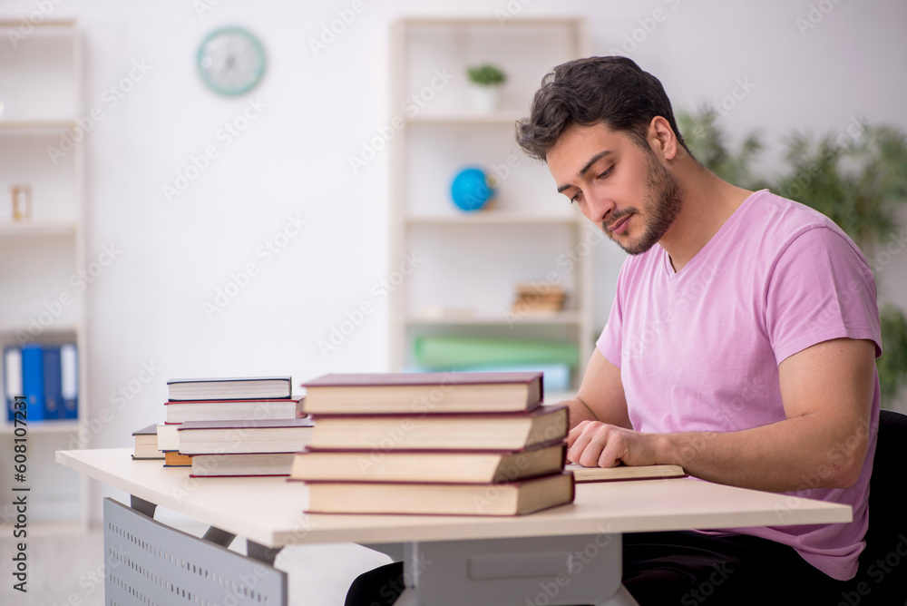 Young male student sitting in the classroom Young male student sitting in the classroom