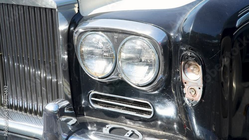 Close up of an old fashioned luxury car headlight. photo