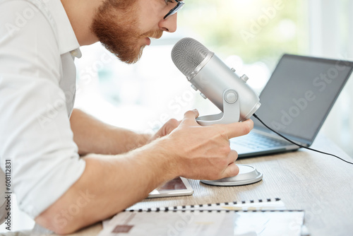 Podcast, talking and business man on microphone of career advice, news broadcast or web platform in office. Live streaming, computer and person speaking, voice and politics or radio discussion on mic