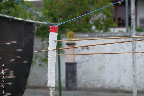 Arrows penetrate the target in traditional Mataraman Jemparingan archery. photo