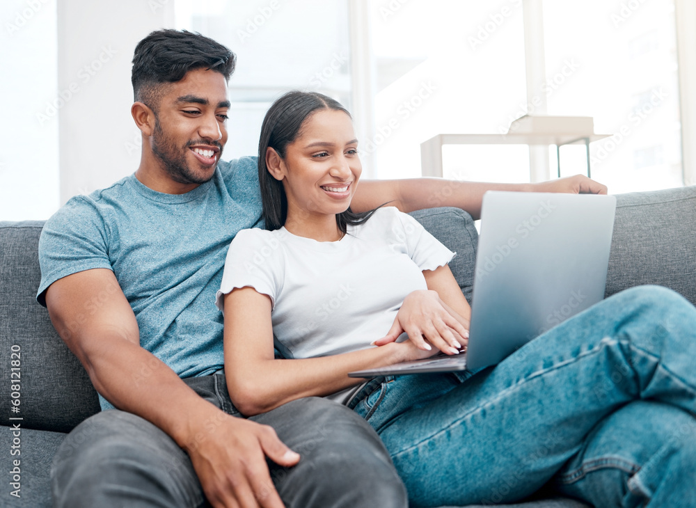 Couple, laptop and watching a video on a lounge sofa with happiness and love at home. Computer, streaming series and young people together on a living room couch in a house with tech and a smile Couple, laptop and watching a video on a lounge sofa with happiness and love at home. Computer, streaming series and young people together on a living room couch in a house with tech and a smile