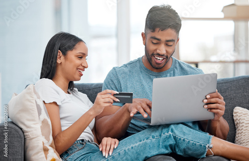 Online shopping, laptop and credit card, couple on sofa in living room and internet banking in home. Technology, ecommerce payment and happy woman and man browsing retail website or digital shop deal
