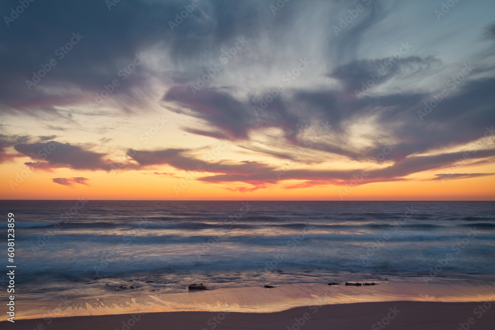 the moment after a beautiful sunset over a beach with pink clouds, Atlantic Ocean, Morocco, Tanger the moment after a beautiful sunset over a beach with pink clouds, Atlantic Ocean, Morocco, Tanger
