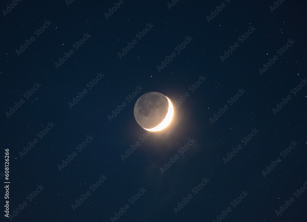 Crescent Moon with Planetshine and stars (collage) in the night sky, photo taken through a telephoto lens
