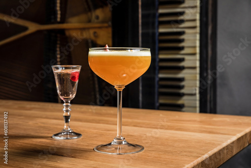 Porn star martini cocktail with passion fruit and vodka at the wooden table at bar or restaurant