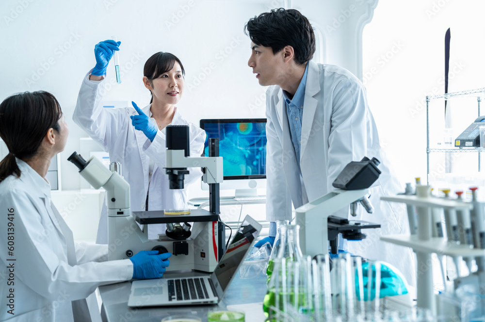 Scientists discussing progress in the laboratory Scientists discussing progress in the laboratory