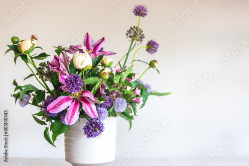 Fototapeta Naklejka Na Ścianę i Meble -  Flowers from a home garden in a vase on a white background.