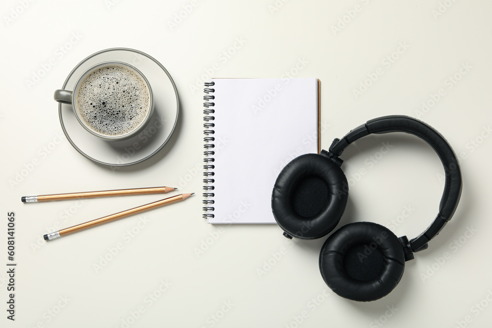 Concept of freelance, composition with hot drink and headphones Concept of freelance, composition with hot drink and headphones