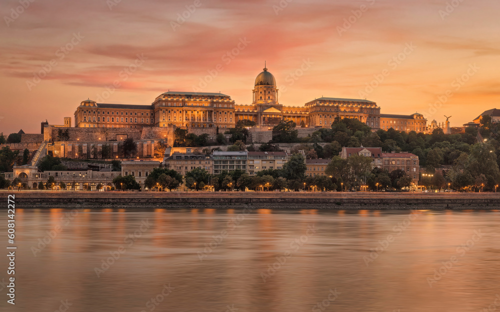 Facade of The Buda Castle with Evening Illumination from The Opposite Side of The Danube at Sunset. Budapest, Hungary.