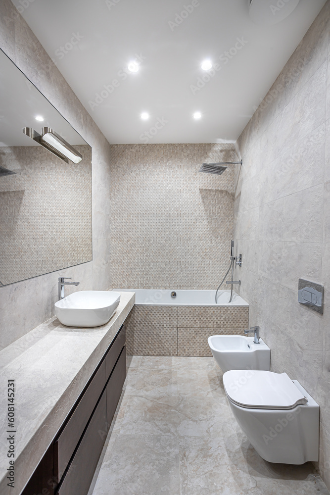 white marble bathroom with toilet, bidet and sinks white marble bathroom with toilet, bidet and sinks