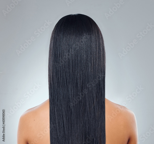 Hair care, back of woman with straight hairstyle and studio backdrop with healthy keratin treatment. Long haircare, growth and style, model with beauty shine and glow on white background from behind.