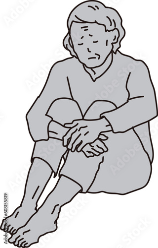 孤独に座る高齢者女性