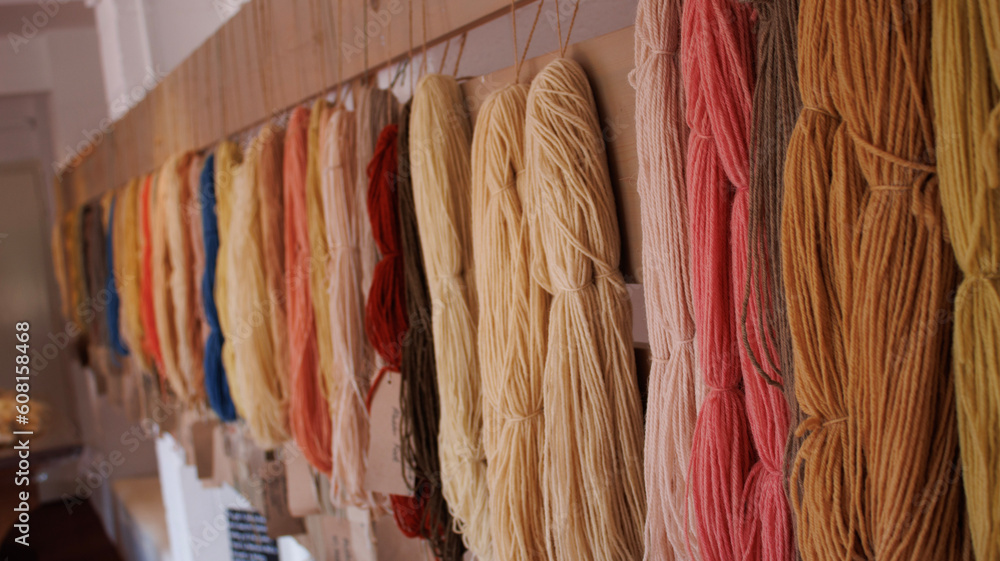 Wool Yarn hanging from the walls of a old house