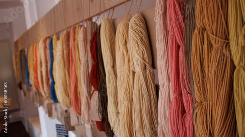 Obraz na płótnie Wool Yarn hanging from the walls of a old house w salonie