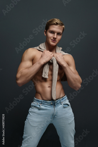 Sexy young man posing in studio