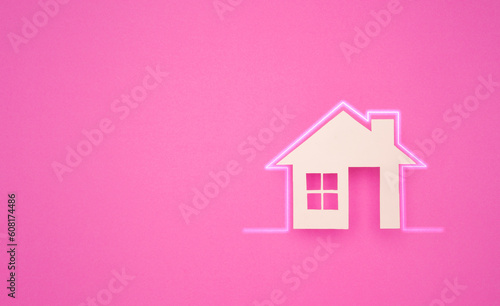 Property investment and house mortgage financial. House made of paper on pink background