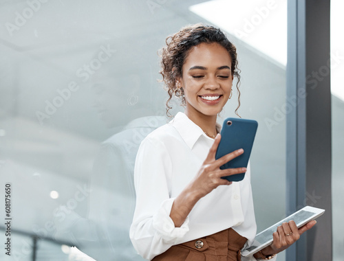 Professional, woman and tablet with mobile phone at a company is typing a conversation on the internet. Female person, business and communication with tech for entrepreneurship at the office.