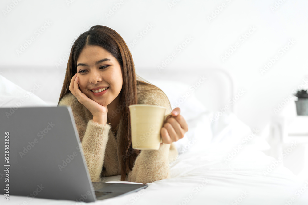 Portrait of asian woman use laptop work digital online marketing internet advertising and sales business technology concept, online marketing, E-business, Ecommerce, Business online at home Portrait of asian woman use laptop work digital online marketing internet advertising and sales business technology concept, online marketing, E-business, Ecommerce, Business online at home