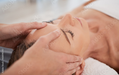 Spa, relax and hands with a head massage for facial wellness, luxury therapy and sleep. Skincare, health and a masseuse massaging temple of a woman at a salon for reflexology and acupressure photo