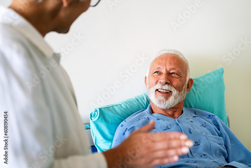 Wallpaper Mural Doctor consulting happy senior man patient on hospital bed. Healthcare and medical insurance concept Torontodigital.ca