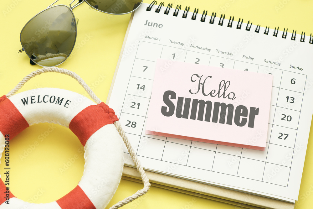 Hello summer word on a piece of paper placed on a calendar. Time for summer  holidays. Stock Photo | Adobe Stock