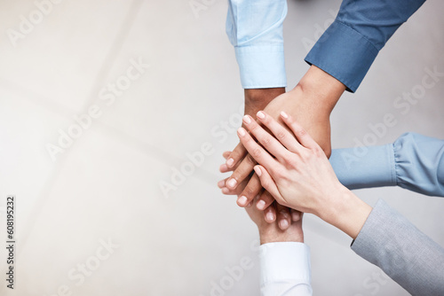 Hands, mockup and a business team in a huddle from above for support, motivation or solidarity. Collaboration, teamwork and space with a group of people or colleagues standing in a circle at work