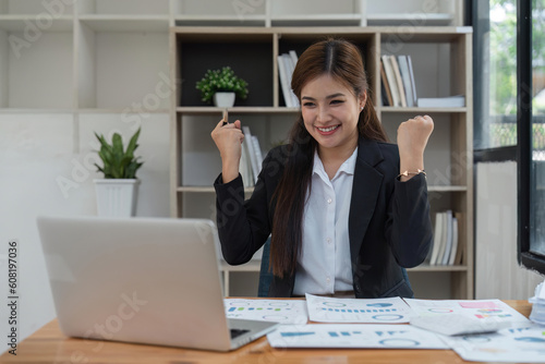 winner business woman with laptop, email announcement of promotion or bonus success. Excited corporate person with fist pump for office celebration, salary increase or target