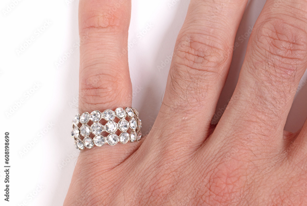 Large diamond ring on the hand on a male adult Large diamond ring on the hand on a male adult