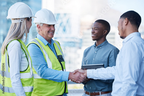 Building deal, happy and people with handshake on site for construction job, logistics and meeting. B2b, support and engineers shaking hands with a black man for a maintenance or inspection contract