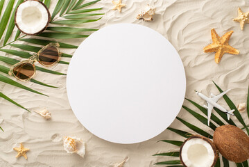 Immerse yourself in summer spirit through picturesque top view arrangement: glasses, aircraft model, shell, starfish, palm leaves, coconut, on sandy shore, accompanied by blank circle for text or ad